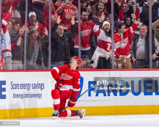 Lucas Raymond of the Detroit Red Wings celebrates his game winning goal in O.T on Juuse Saros of the Nashville Predators at Little Caesars Arena on...