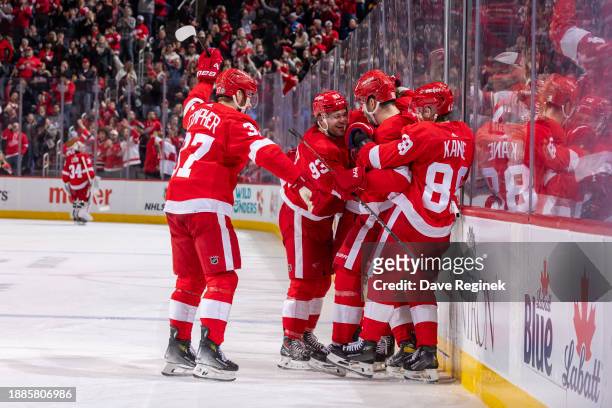 Jake Walman of the Detroit Red Wings celebrates his goal on Juuse Saros of the Nashville Predators with teammates during the third period at Little...
