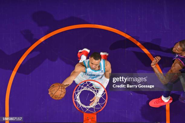 Bryce McGowans of the Charlotte Hornets drives to the basket during the game against the Phoenix Suns on December 29 2023 at Footprint Center in...