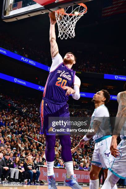 Jusuf Nurkic of the Phoenix Suns drives to the basket during the game against the Charlotte Hornets on December 29 2023 at Footprint Center in...