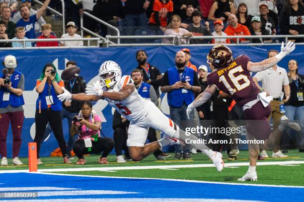 Jaylon Tillman of the Bowling Green Falcons attempts a catch against Coleman Bryson of the Minnesota Golden Gophers during the second half of the...