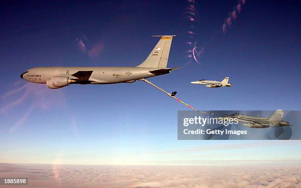 Two Australian Air Force F/A-18 Hornets refuel from a U.S. Air Force KC-10 refueler as they fly over Kuwait March 30, 2003. Coalition war planes...