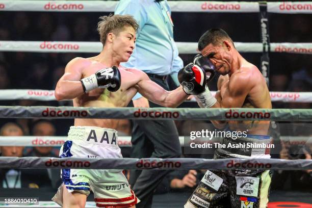 Naoya Inoue of Japan connects his left on Marlon Tapales of the Philippines in the 5th round during the IBF, WBO, WBA and WBC Super Bantamweight...