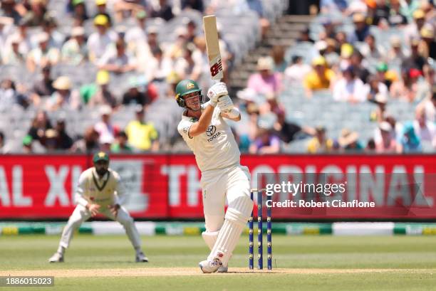 Pat Cummins of Australia hits out as he is caught by Mir Hamza of Pakistan during day two of the Second Test Match between Australia and Pakistan at...