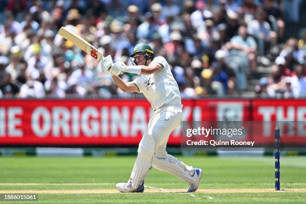 Pat Cummins of Australia hits out as he is caught by Mir Hamza of Pakistan during day two of the Second Test Match between Australia and Pakistan at...