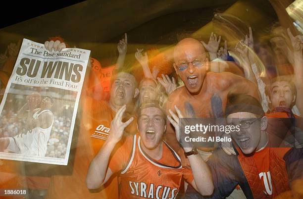 Fans of the Syracuse Orangemen celebrate Syracuse's 63-47 win over the Oklahoma Sooners during the East Regionals of the NCAA Championship on March...