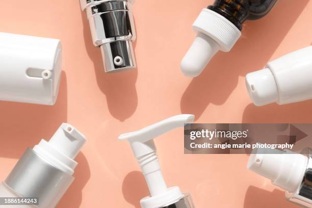 tops of skincare bottles - products stock pictures, royalty-free photos & images