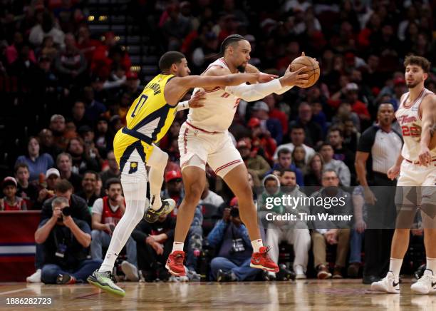 Tyrese Haliburton of the Indiana Pacers defends Dillon Brooks of the Houston Rockets in the first half at Toyota Center on December 26, 2023 in...