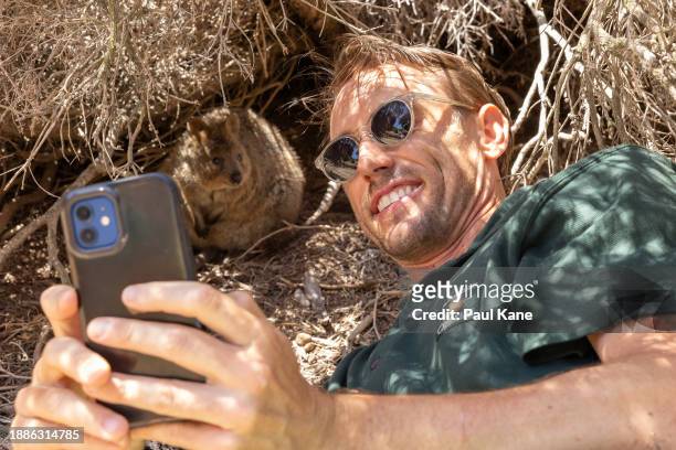 John Millman of Team Australia takes a selfie with a Quokka on Rottnest Island ahead of the 2024 United Cup on December 27, 2023 in Perth, Australia.