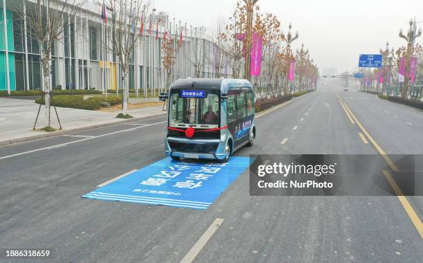 Driverless bus is operating in a geographic information town in Deqing County, Huzhou City, Zhejiang Province, East China, on December 30, 2023. It...