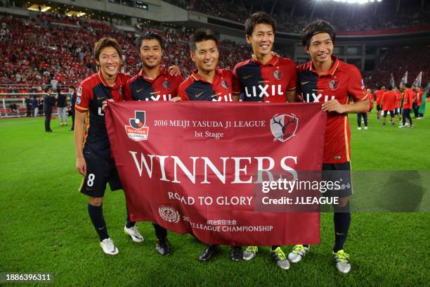 Shoma Doi, Mitsuo Ogasawara, Yasushi Endo, Shuto Yamamoto and Gaku Shibasaki of Kashima Antlers celebrate the J.League J1 first stage champions...