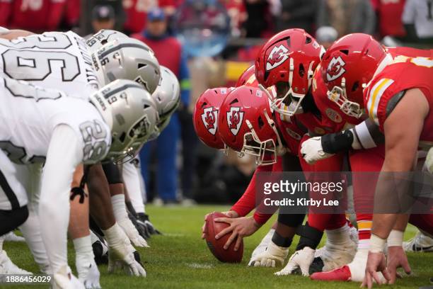 Helmets at the line of scrimmage as Kansas City Chiefs long snapper James Winchester snaps the ball against the Las Vegas Raiders during an NFL...