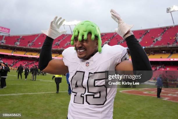 Las Vegas Raiders fullback Jakob Johnson wears a Nickelodeon slime head hat during an NFL football game against the Kansas City Chiefs on December...