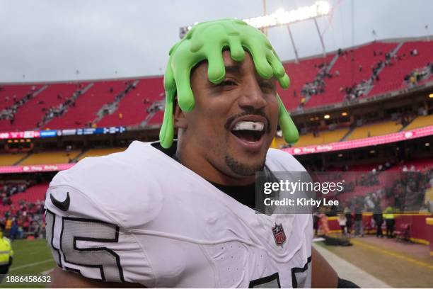 Las Vegas Raiders fullback Jakob Johnson wears a Nickelodeon slime head hat during an NFL football game against the Kansas City Chiefs on December...