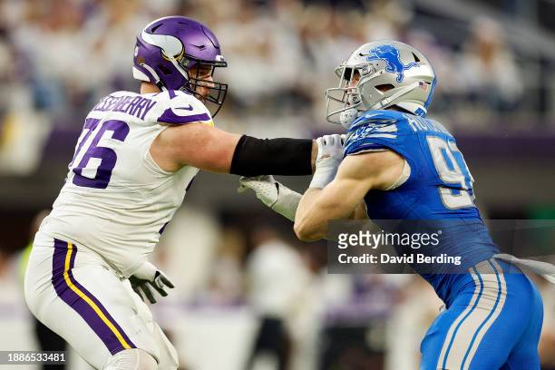 Aidan Hutchinson of the Detroit Lions competes against David Quessenberry of the Minnesota Vikings in the first half at U.S. Bank Stadium on December...