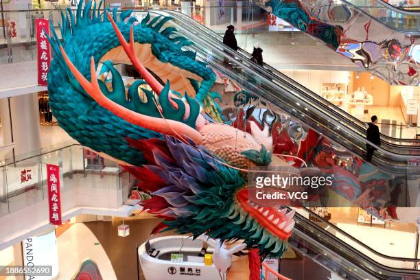 Meter-tall paper dragon statue is seen at a shopping mall on December 27, 2023 in Shenyang, Liaoning Province of China. The upcoming year is the year...