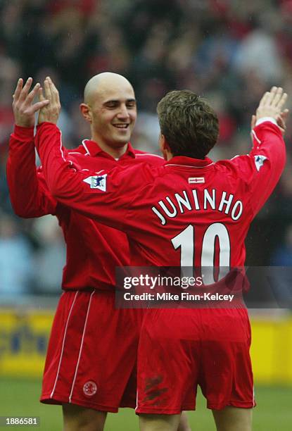 Juninho of Middlesbrough celebrates scoring the equalising goal with team-mate Massimo Maccarone during the FA Barclaycard Premiership match between...