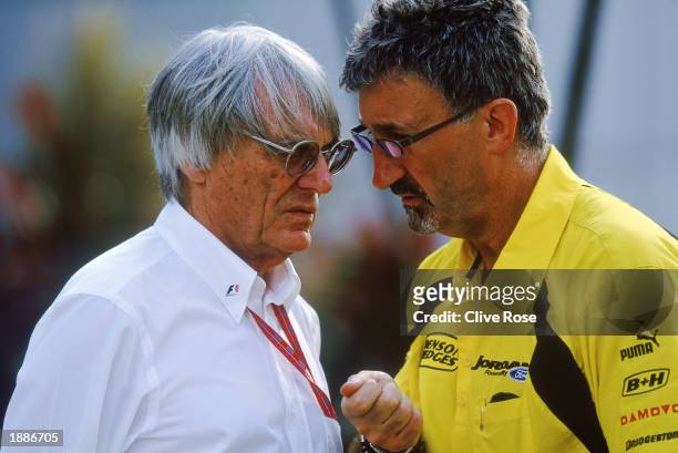 Boss Bernie Ecclestone chats to Jordan-Ford boss Eddie Jordan during the Malaysian Formula One Grand Prix held on March 23, 2003 at the Sepang...