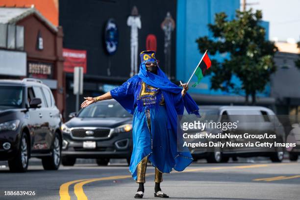 Los Angeles, CA Queen Isis walks along Crenshaw Boulevard during the KwanZaa Gwaride Parade in South Los Angeles Leimert Park on Tuesday, December...