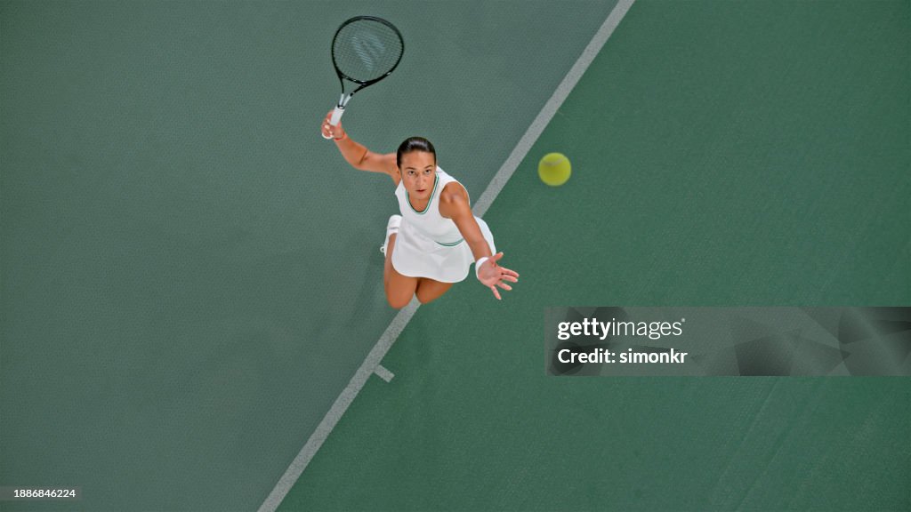 Tennis player playing in tennis court