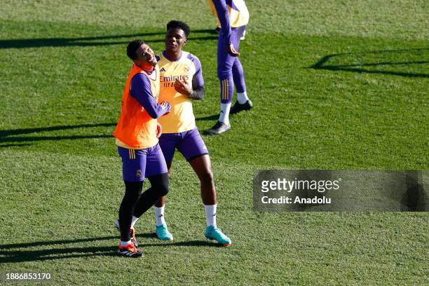 Jude Bellingham and Aurelien Tchouameni attend the last training session of 2023 open to the supporters at Alfredo Di Stefano stadium in Madrid,...