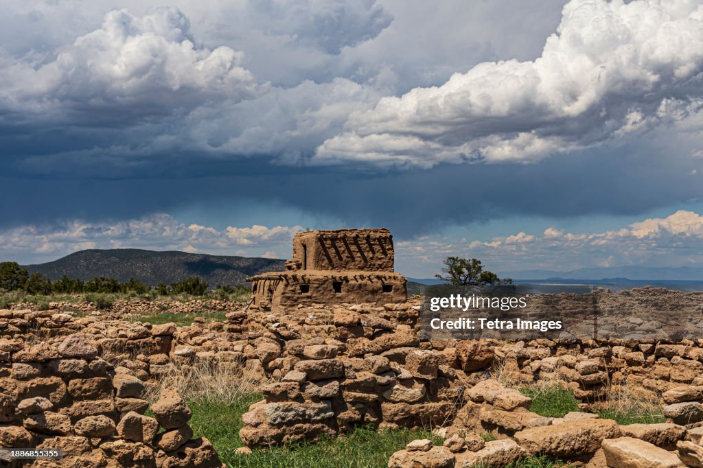 USA, New Mexico, Espanola, Puye Cliffs, Storm clouds over Puye Cliff Dwellings