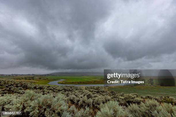 heavy storm clouds over oxbow bend - oxbow bend stock pictures, royalty-free photos & images