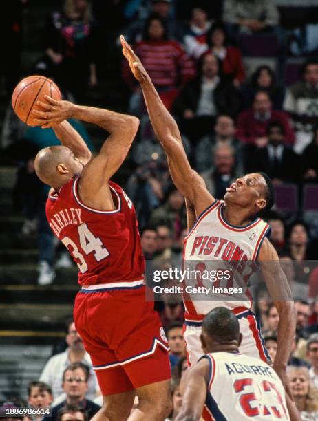Charles Barkley , Small Forward for the Philadelphia 76ers jumps to make a shot to the basket over the attempted block by Dennis Rodman, Power...
