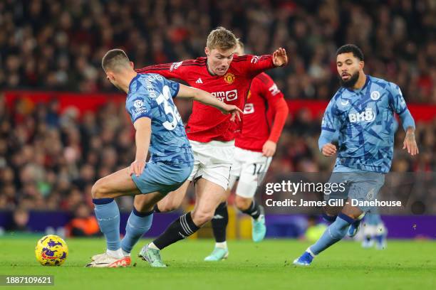 Rasmus Hojlund of Manchester United battles for possession with Leander Dendoncker of Aston Villa during the Premier League match between Manchester...