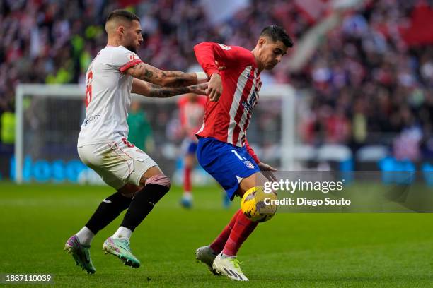Alvaro Morata of Atletico de Madrid battles for the ball with Nemanja Gudelj Sevilla FC during the LaLiga EA Sports match between Atletico Madrid and...