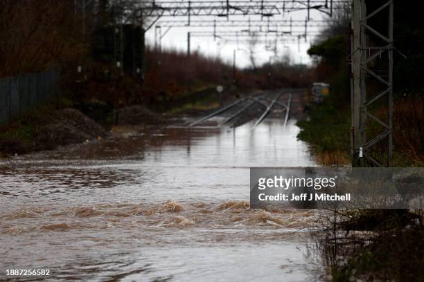 General view of the flooded railway line at Bowling station on December 27, 2023 in Bowling, Scotland. The Met Office issued yellow wind warnings,...