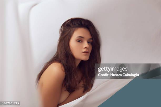 a sensuously beautiful young woman in flowing white cloth. - sensuously stock pictures, royalty-free photos & images