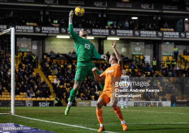 Blackpool's Jordan Rhodes pressures Port Vale's goalkeeper Connor Ripley during the Sky Bet League One match between Port Vale and Blackpool at Vale...