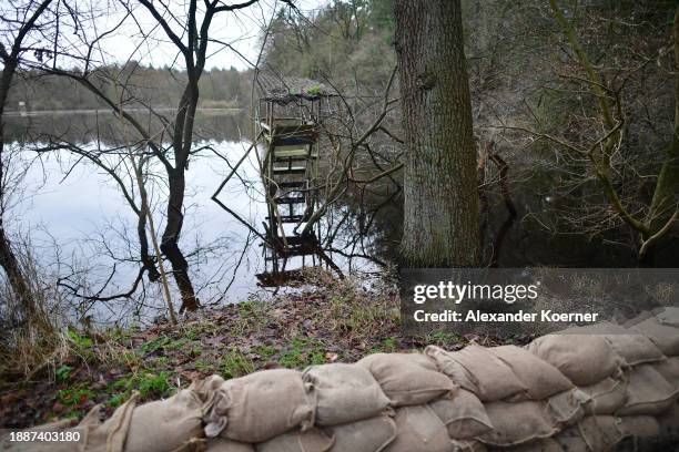 Sandbags lie on a railway track close a dyke next to the village of Wardenburg along the flooding Hunte river on December 30, 2023 near Oldenburg,...