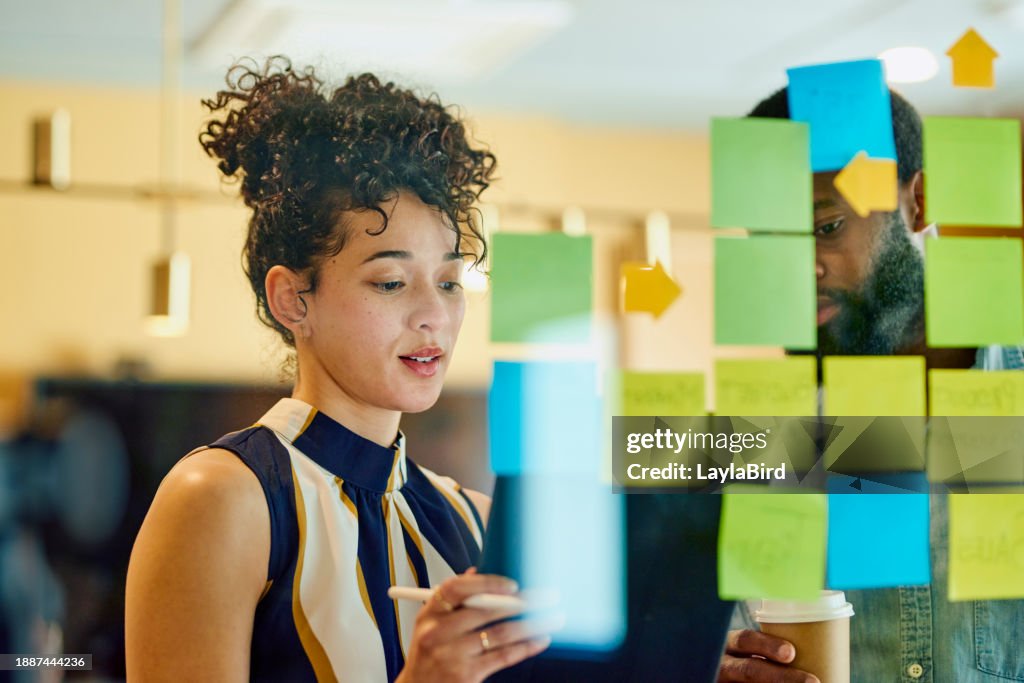 Two business professionals discussing ideas in an office.