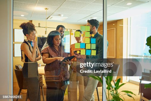 Diverse group brainstorming ideas in modern office space Diverse group brainstorming ideas in modern office space