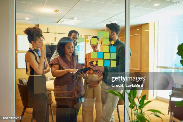 diverse group brainstorming ideas in modern office space - challenge stock pictures, royalty-free photos & images