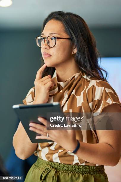 thoughtful businesswoman using tablet - resilience work stock pictures, royalty-free photos & images