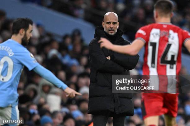 Manchester City's Spanish manager Pep Guardiola looks on during the English Premier League football match between Manchester City and Sheffield...
