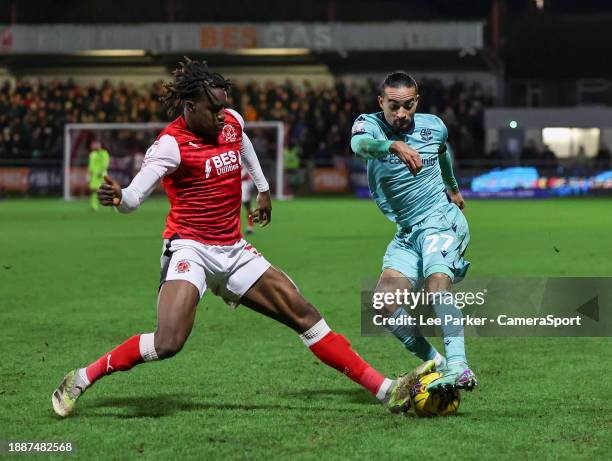 Bolton Wanderers' Randell Williams is tackled by Fleetwood Town's Bosun Lawal during the Sky Bet League One match between Fleetwood Town and Bolton...