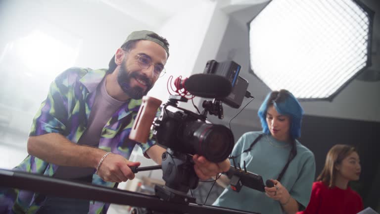 https://media.gettyimages.com/id/1887491945/video/zoom-in-portrait-of-a-group-of-young-film-students-working-on-their-school-project-creative.jpg?b=1&s=640x640&k=20&c=OLvebtziIwvGcSQSls5-ZVGd5O5EEqUitoNAv5McToU=