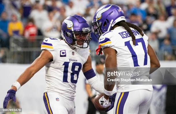 Justin Jefferson of the Minnesota Vikings celebrates with K.J. Osborn after scoring a touchdown in the second quarter of the game against the Detroit...