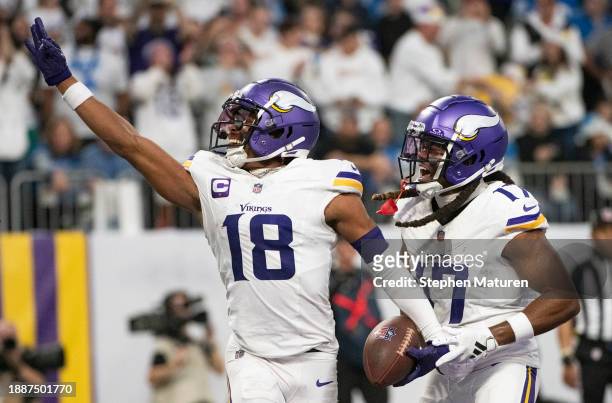 Justin Jefferson of the Minnesota Vikings celebrates with K.J. Osborn after scoring a touchdown in the second quarter of the game against the Detroit...