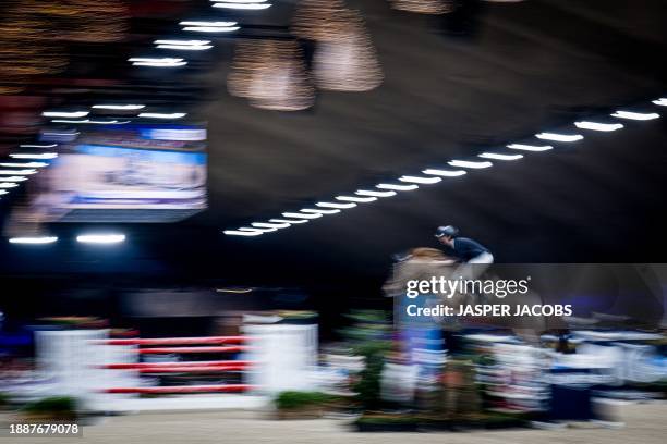 Belgian rider Pieter Devos Mom's Toupie de la Roque pictured in action during the FEI World Cup Jumping competition at the 'Vlaanderens Kerstjumping...