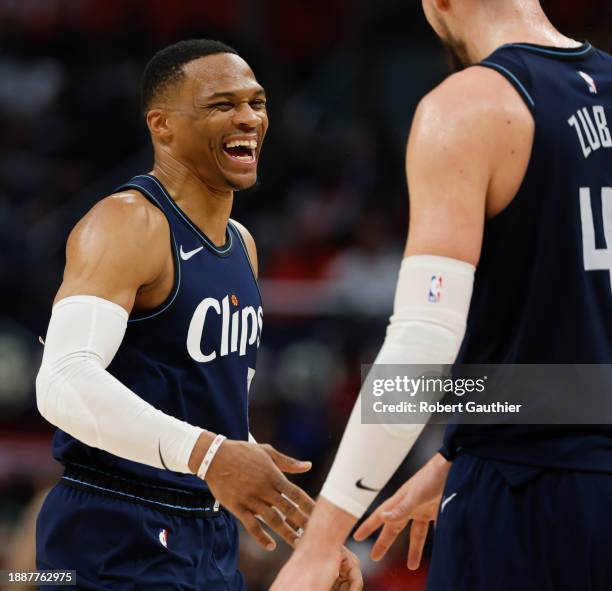 Los Angeles, CA, Friday, December 29, 2023 - TLA Clippers guard Russell Westbrook congratulates teammate Ivica Zubac after assisting him on a basket...