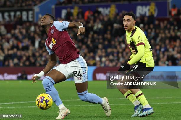 Burnley's English midfielder Aaron Ramsey fouls Aston Villa's Columbian striker Jhon Duran for a penalty during the English Premier League football...