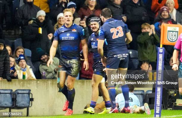 Edinburgh's Duhan van der Merwe celebrates with teammates after scoring a try during a BKT United Rugby Championship match between Edinburgh Rugby...