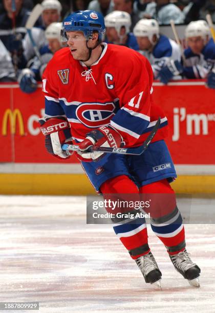 Saku Koivu of the Montreal Canadiens skates against the Toronto Maple Leafs during NHL game action on January 24, 2004 at Bell Centre in Montreal,...