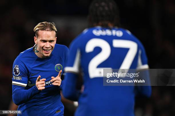 Mykhaylo Mudryk of Chelsea celebrates with Malo Gusto of Chelsea after scoring their team's first goal during the Premier League match between...