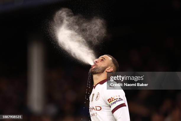 Kyle Walker of Manchester City spits out water prior to the Premier League match between Everton FC and Manchester City at Goodison Park on December...